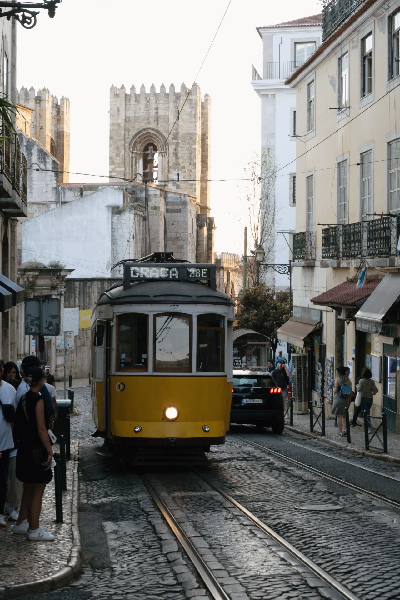 Tram 28 in Lisbon passing by Lisbon Cathedral